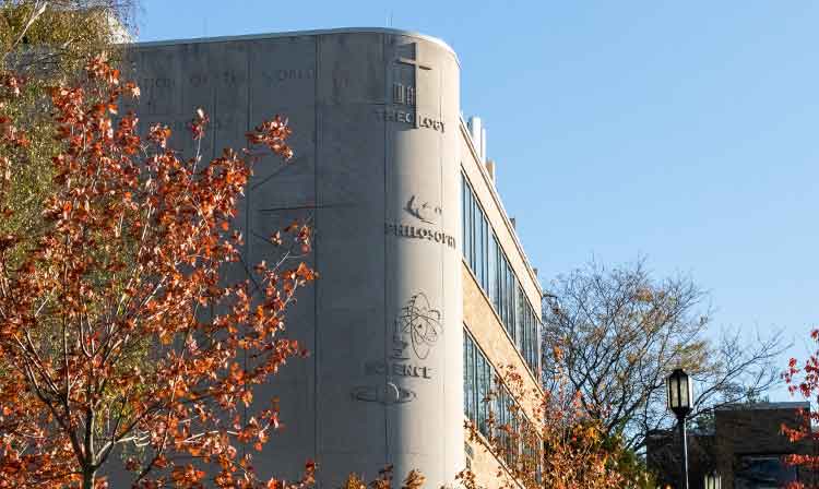 Exterior photo of Canisius Hall in Fall.  Home to the College of Arts & Sciences offices.