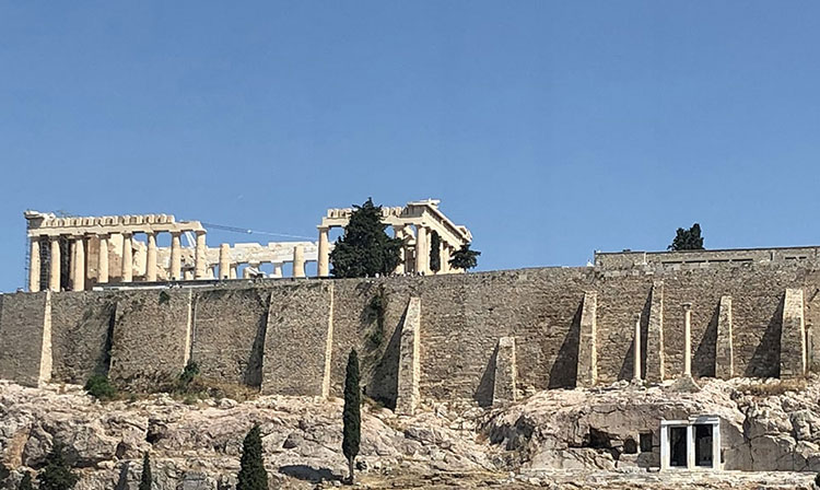 Ruins of an ancient building in what looks like Greece. 