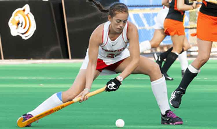 Field hockey player prepares to take a shot 