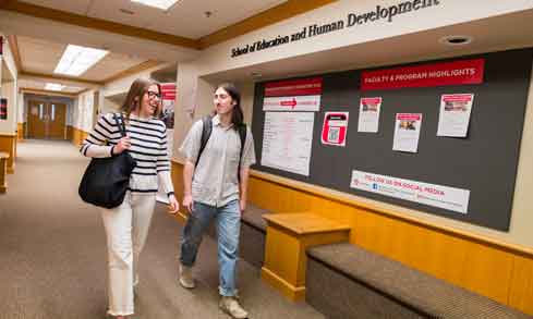 Two students walking in Canisius Hall