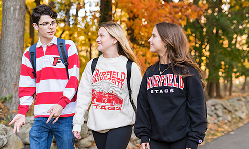 Fairfield students and their parents pose for a photo on move in day. 