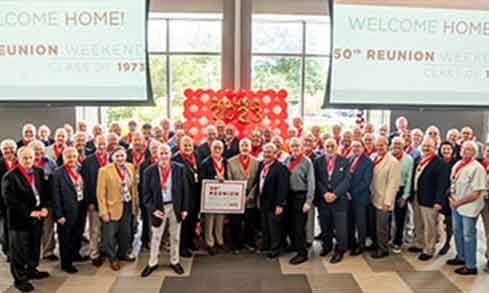 The 50th reunion class posing for photo.