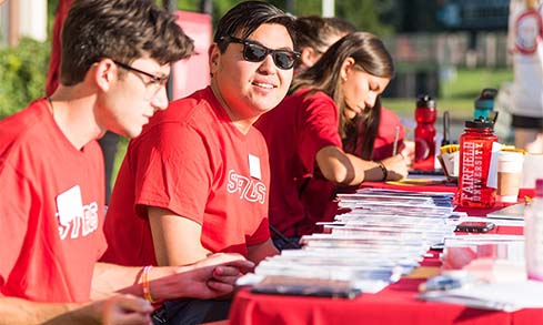 Image of students at registration table