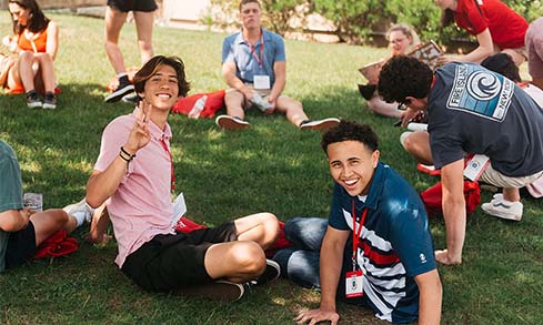 Image of students sitting on grass