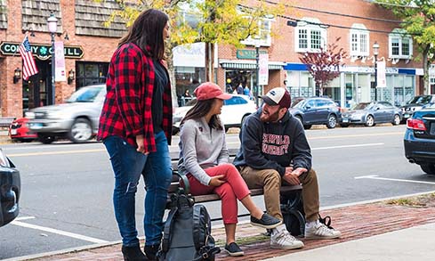 Image of students talking by a bench in downtown Fairfield