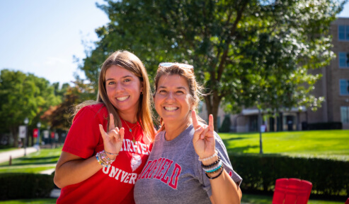 Image of parent and student posing for picture