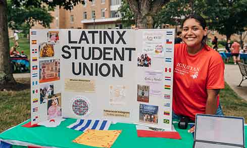 Latinx student union members gather, sharing ideas and celebrating culture in a vibrant, inclusive environment.