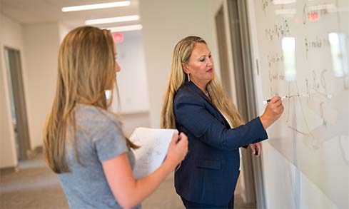 Image of student and teacher in classroom