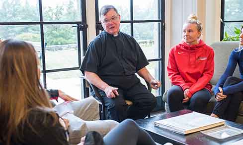 Photo of Murphy Center staff talking to students