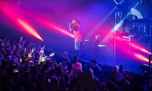 An artists performs on stage at a concert for Fairfield University students.