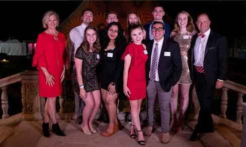 Student pose with the president during pres ball.