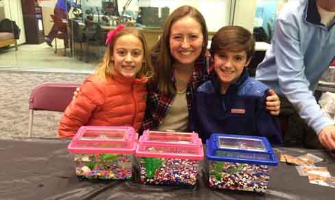 A Fairfield student poses with her younger siblings.