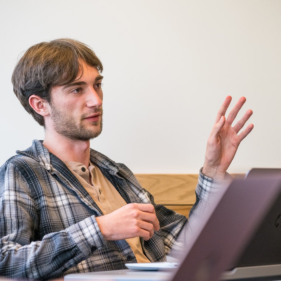 A student explaining something in class. 