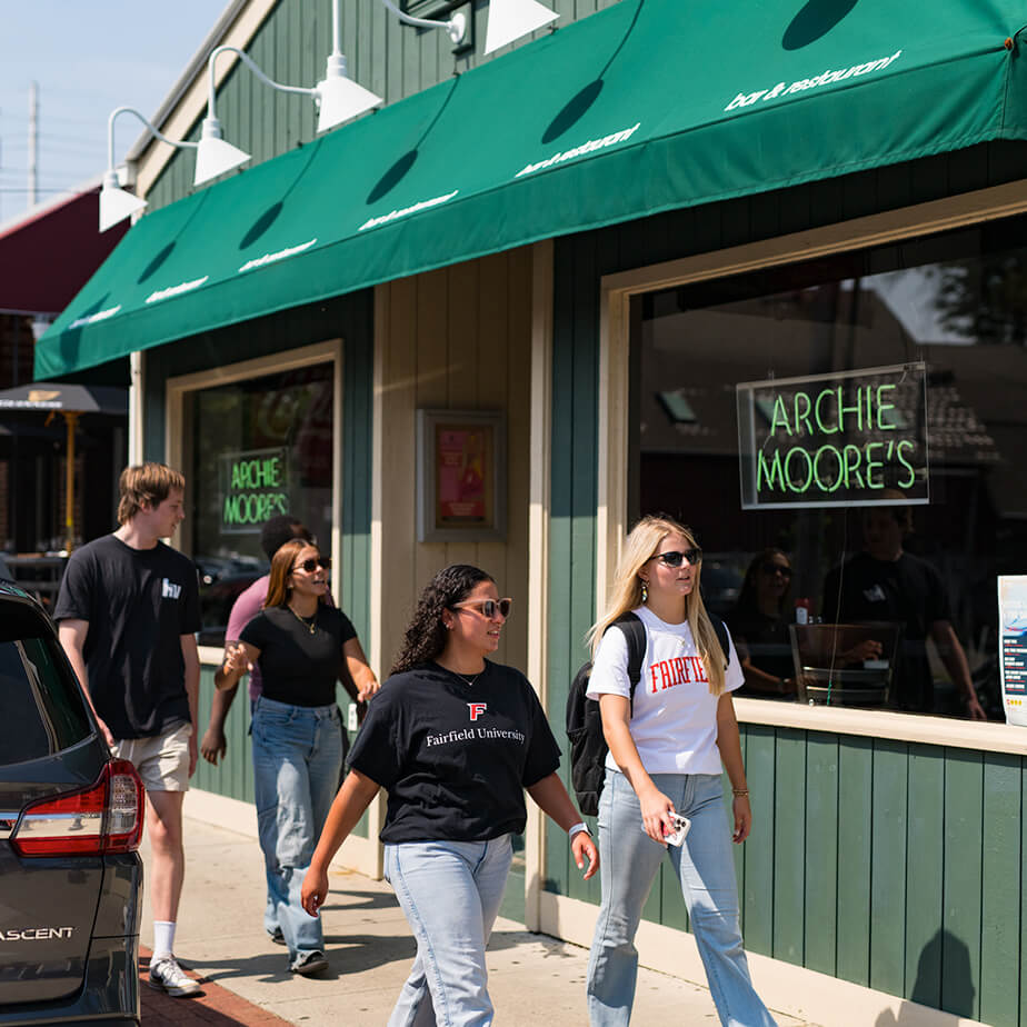 A group of students walking in downtown Fairfield, CT