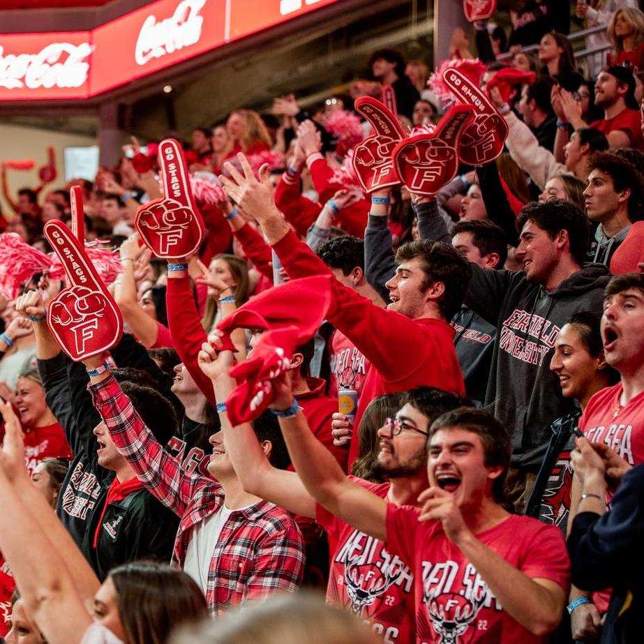 Fairfield students cheering during a women's basketball game. 