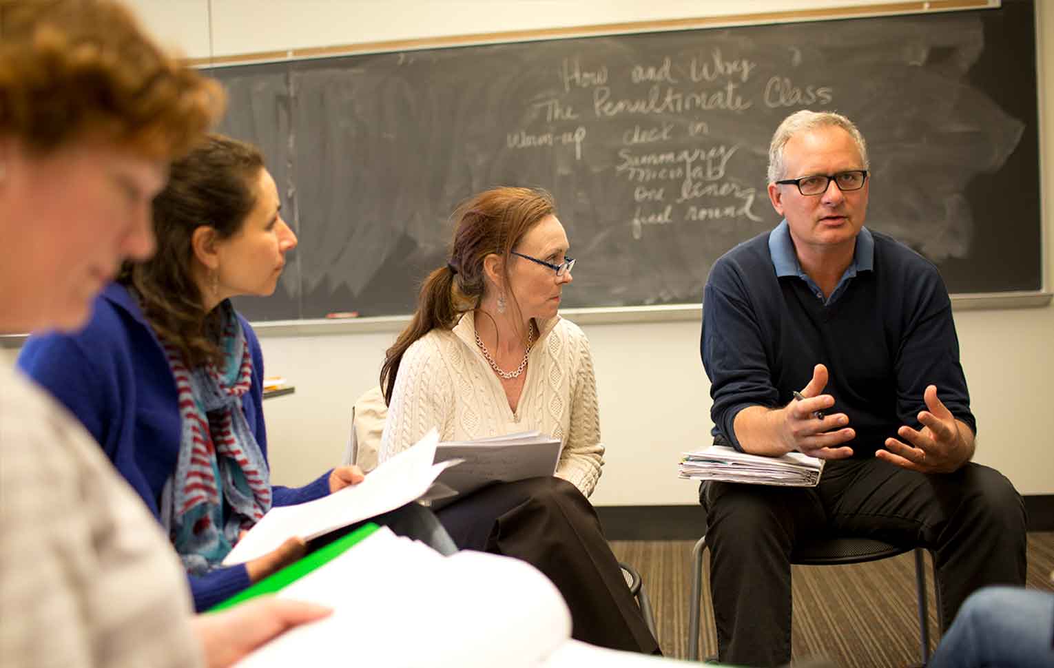 faculty speaking in a group.