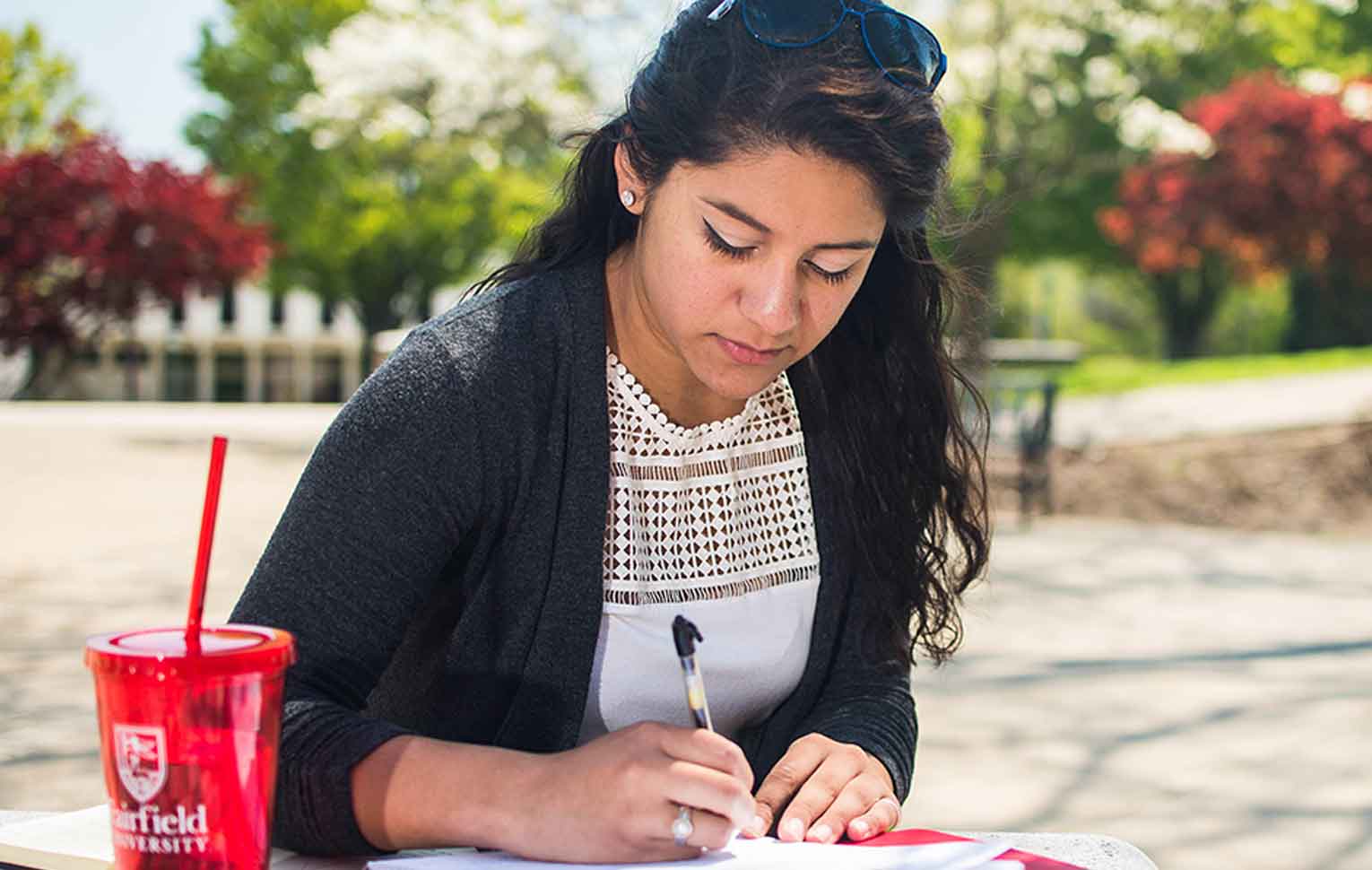 student writing in notebook