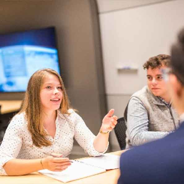 students having a discussion in class.