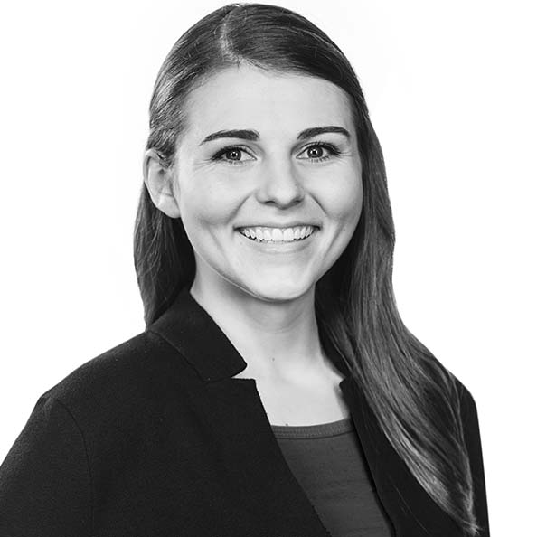 Student posing for a headshot with a white background. 