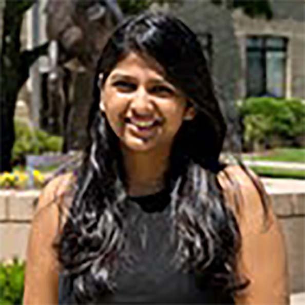 Headshot of student Shreya in front of the stag statue on campus.  