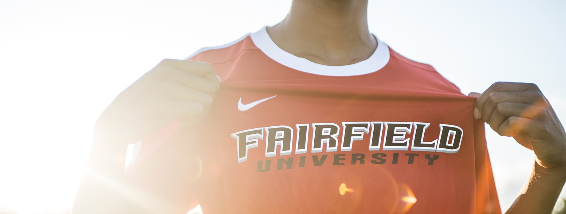 Fairfield student-athlete showing off their premium Fairfield University jersey.