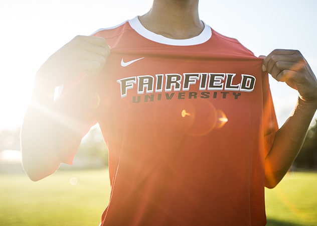 Fairfield student-athlete showing off their premium Fairfield University jersey.