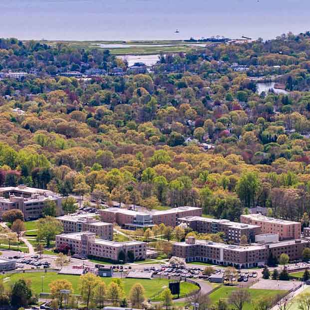 Aerial photo of the Fairfield University campus with the Long Island Sound in thebackground.