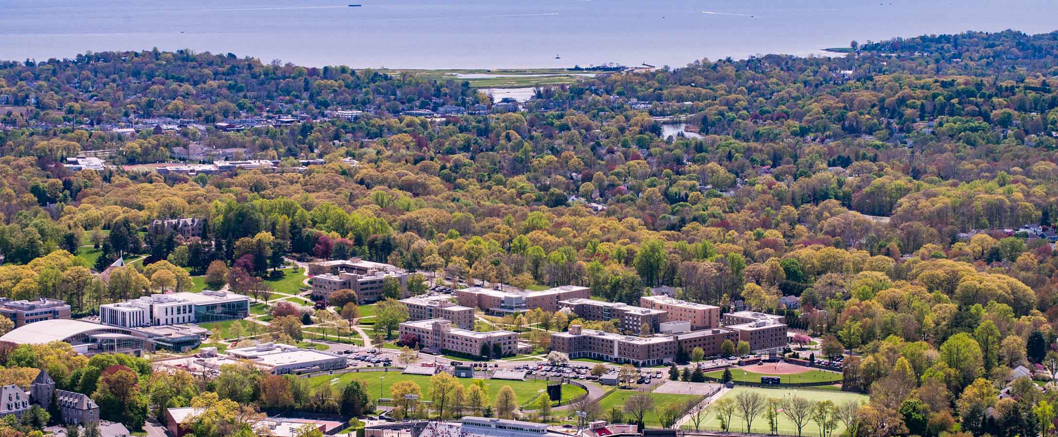 Aerial photo of the Fairfield University campus with the Long Island Sound in thebackground.