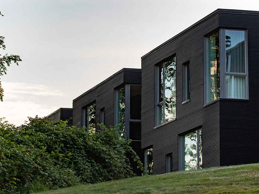 Jesuit Community Residence exterior and dusk.