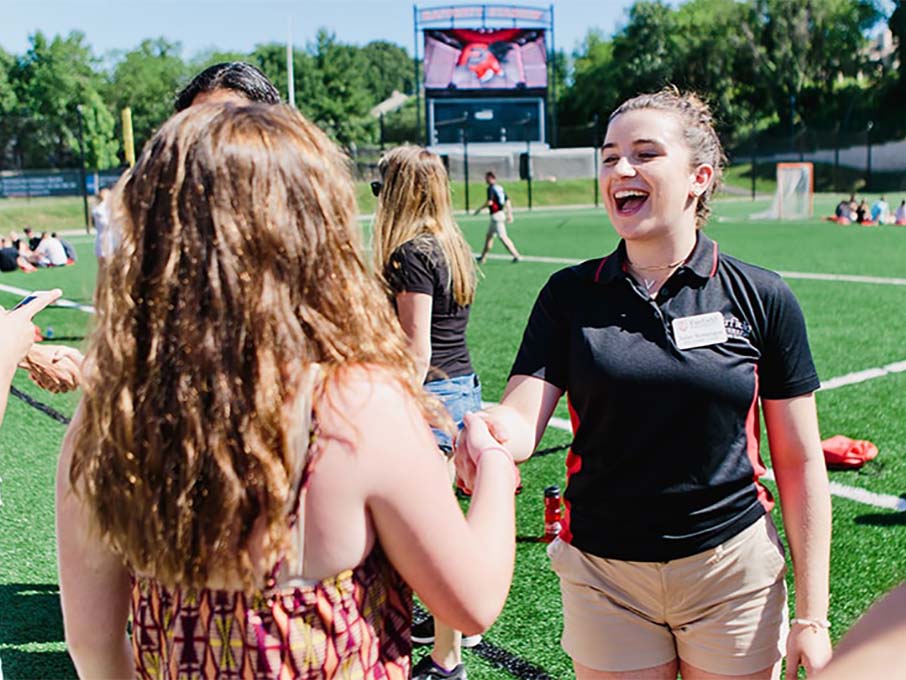 Image of students shaking hands