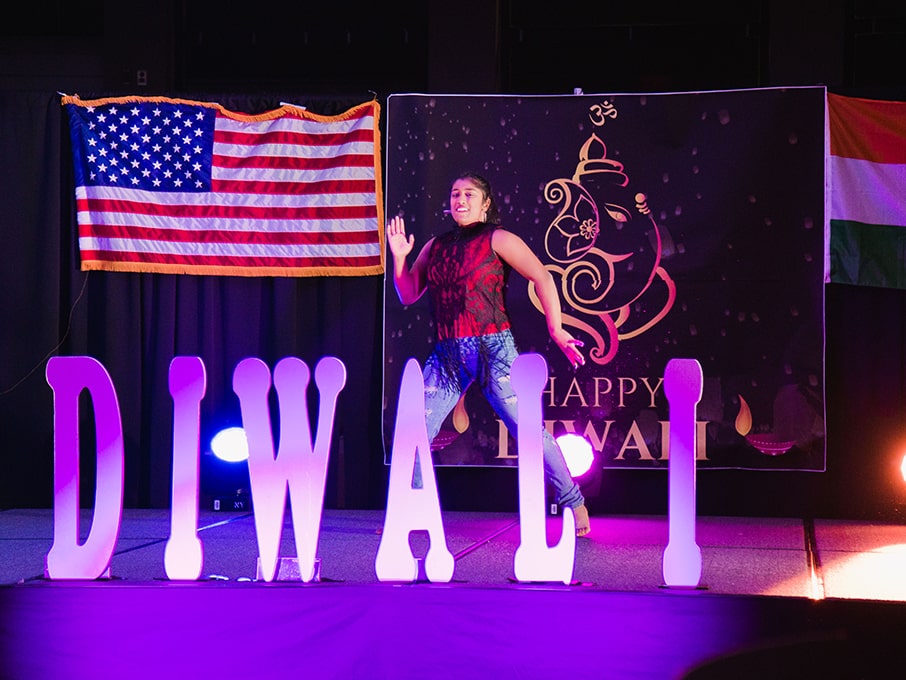 Student at Diwali celebration dancing.