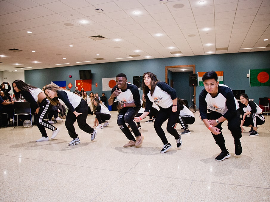 Students performing a syncronized dance routine.