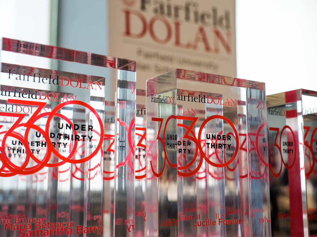 A celebration of the Fairfield Dolan 30 under 30 awards, featuring a table full of transparent awards.