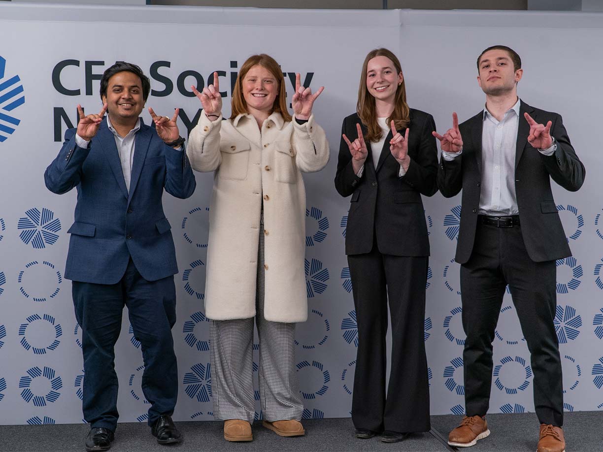 Image ofGraduate student Pushkaraj Makarand Kalkar with undergraduates Lucille Fowler '25, Sara Wentland ’26, and Matthew Molta ’25 at the 2025 New York Regional CFA Institute Research Challenge.