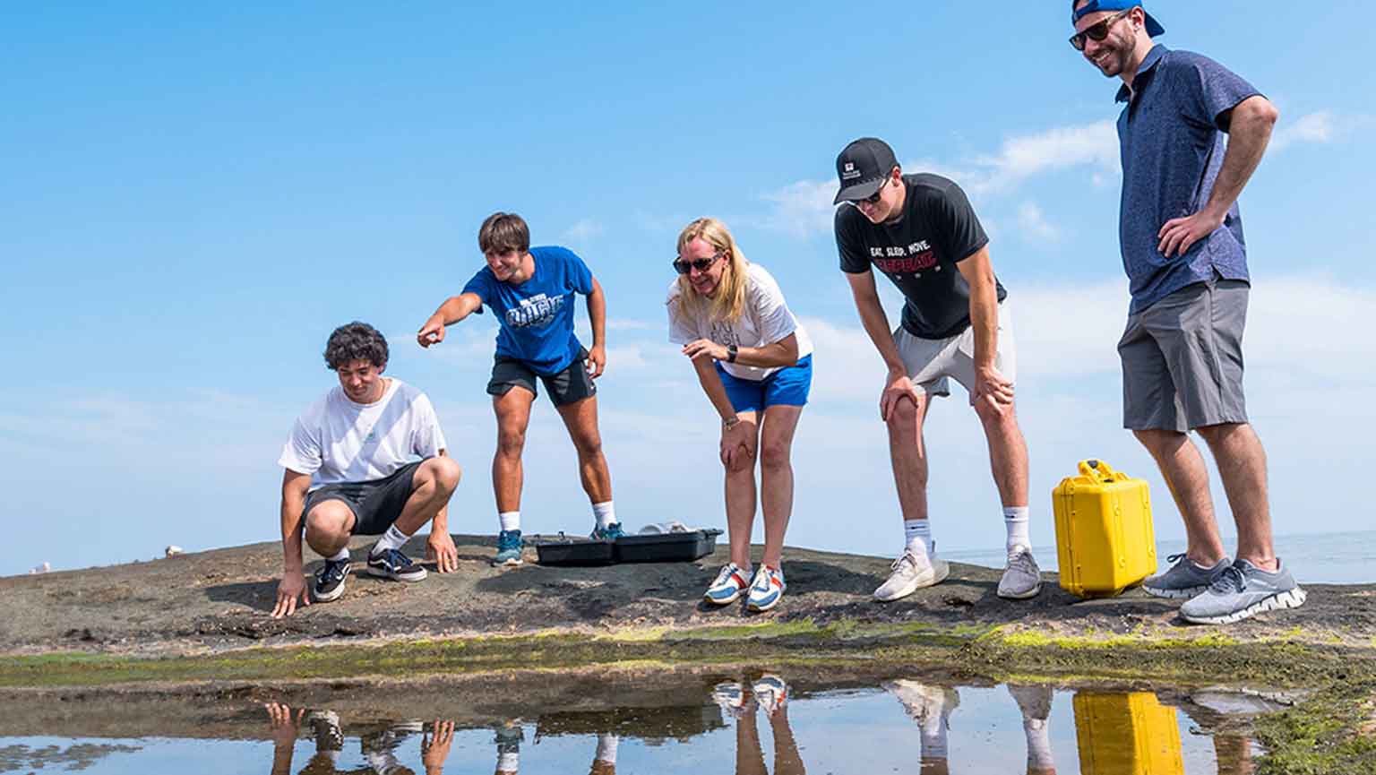 Fairfield University students collect samples to measure water quality.