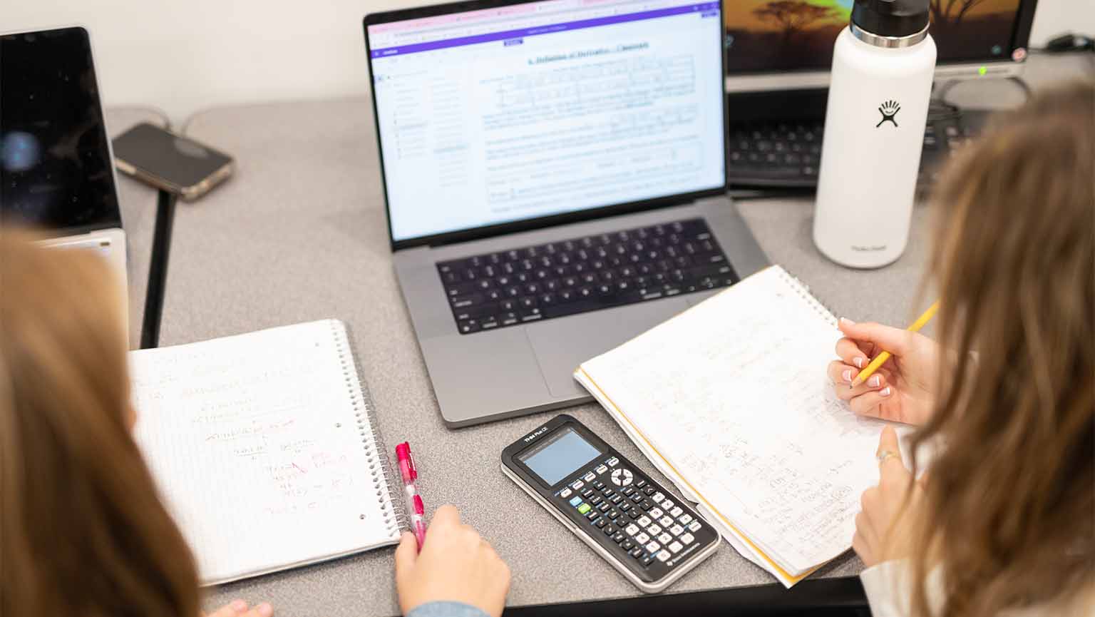 two students doing homework