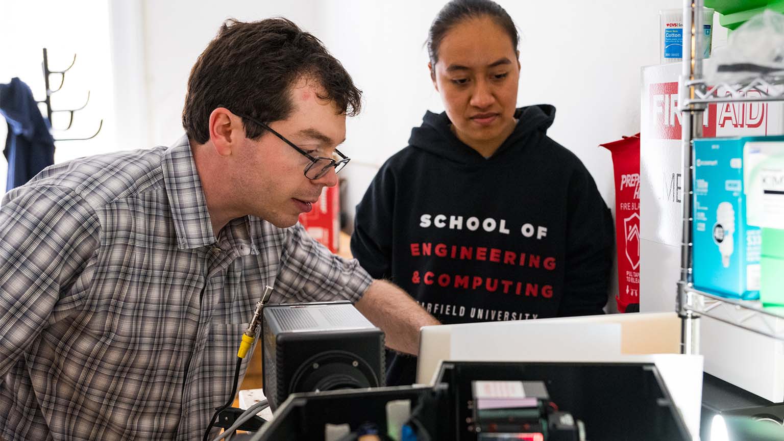 David Shekhtman, PhD and engineering student working on project in lab 