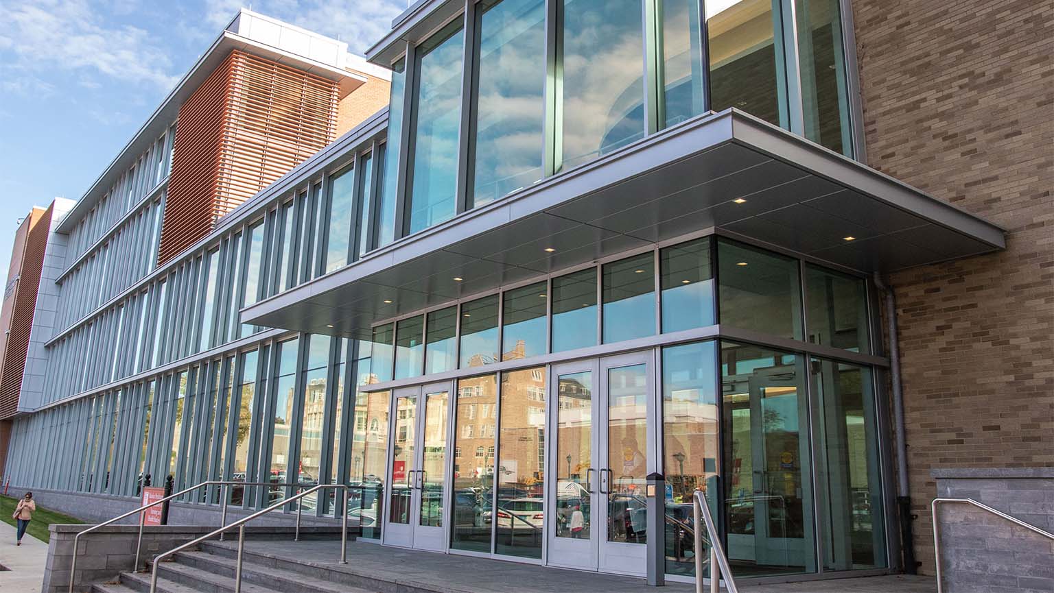 Image of a modern building featuring a large glass wall.