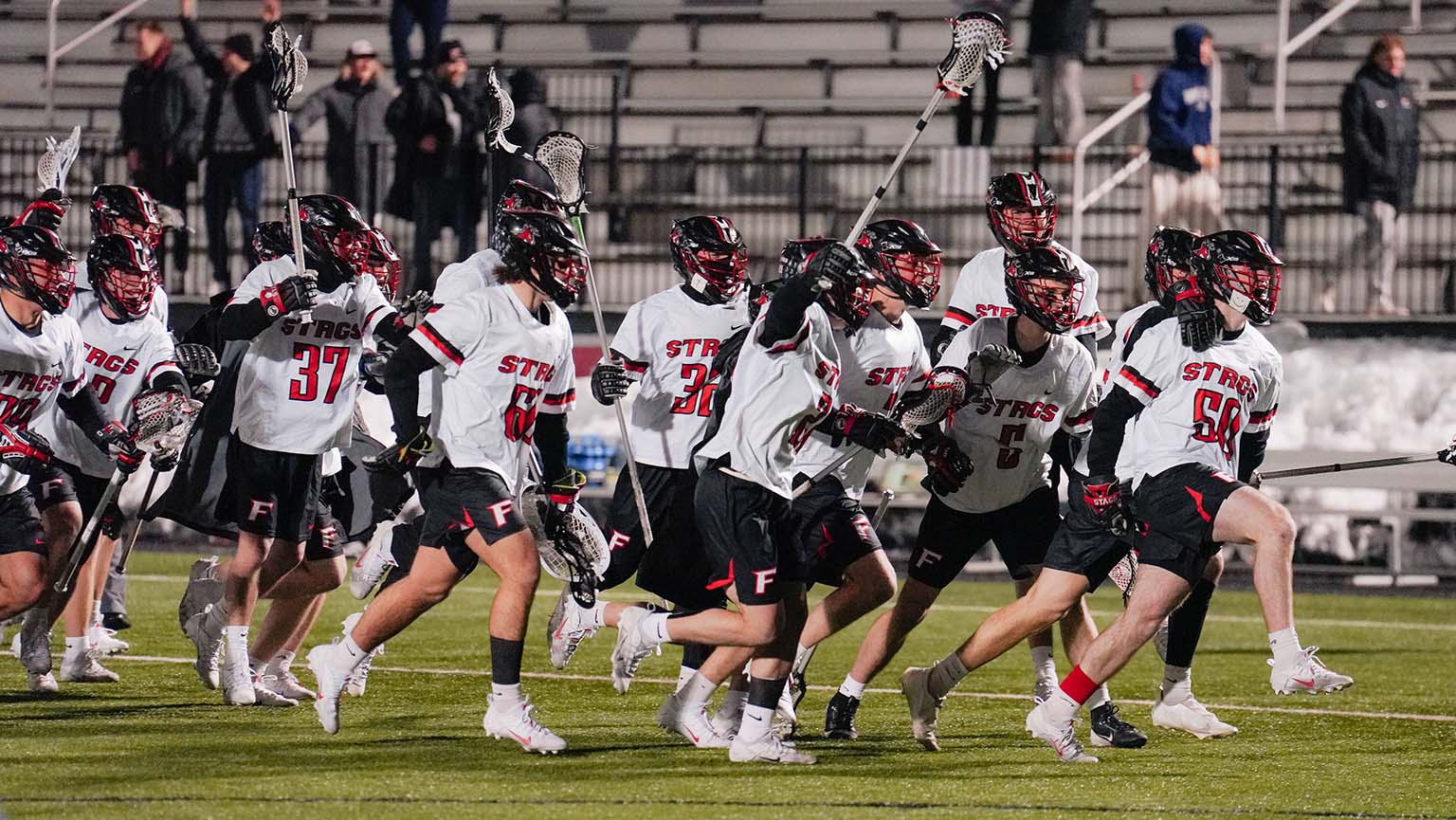 A Fairfield University lacrosse players celebrating.