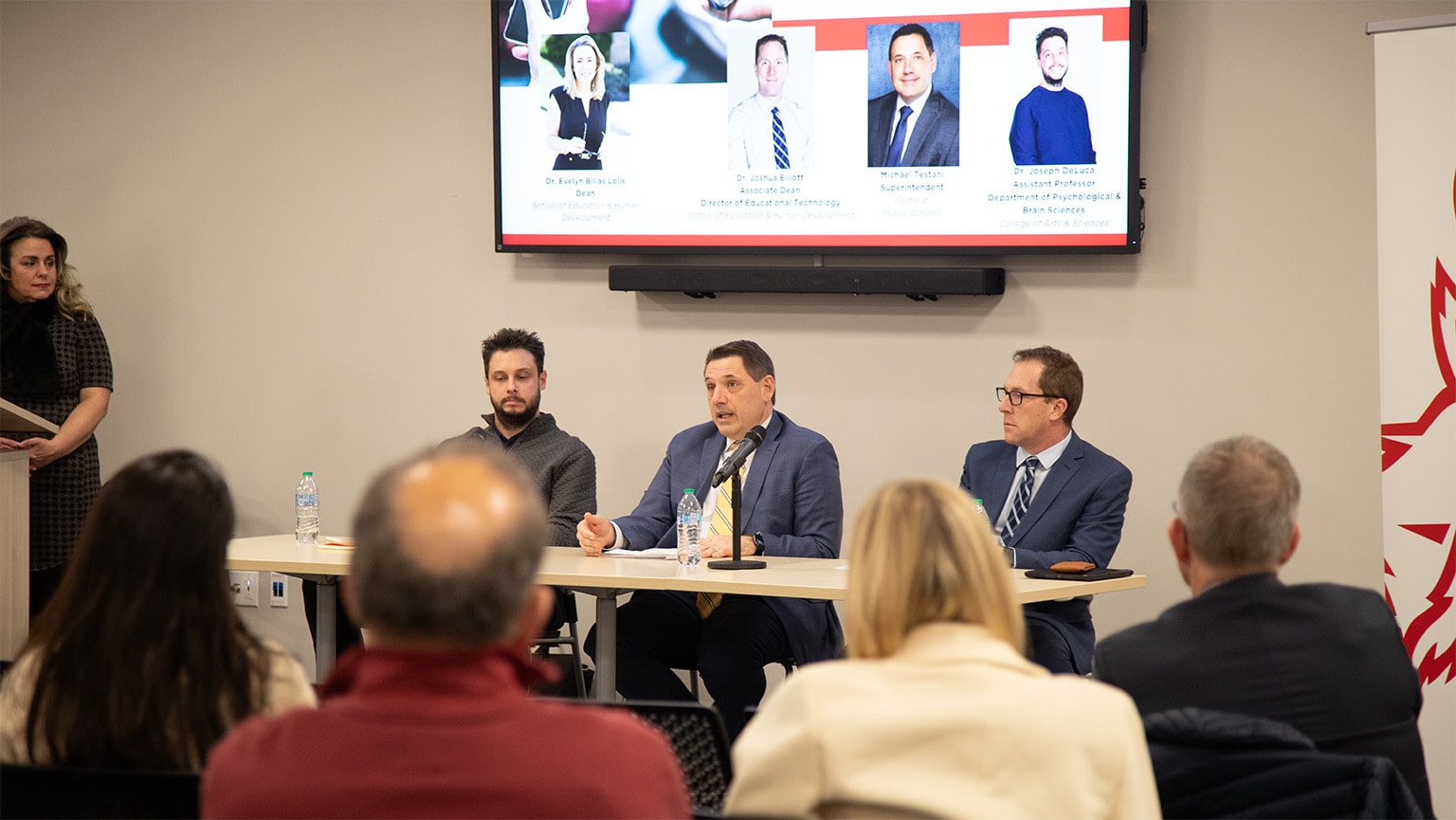 Three panelists engaging the audience in a discussion regarding the effects of screen time on learning and mental health.