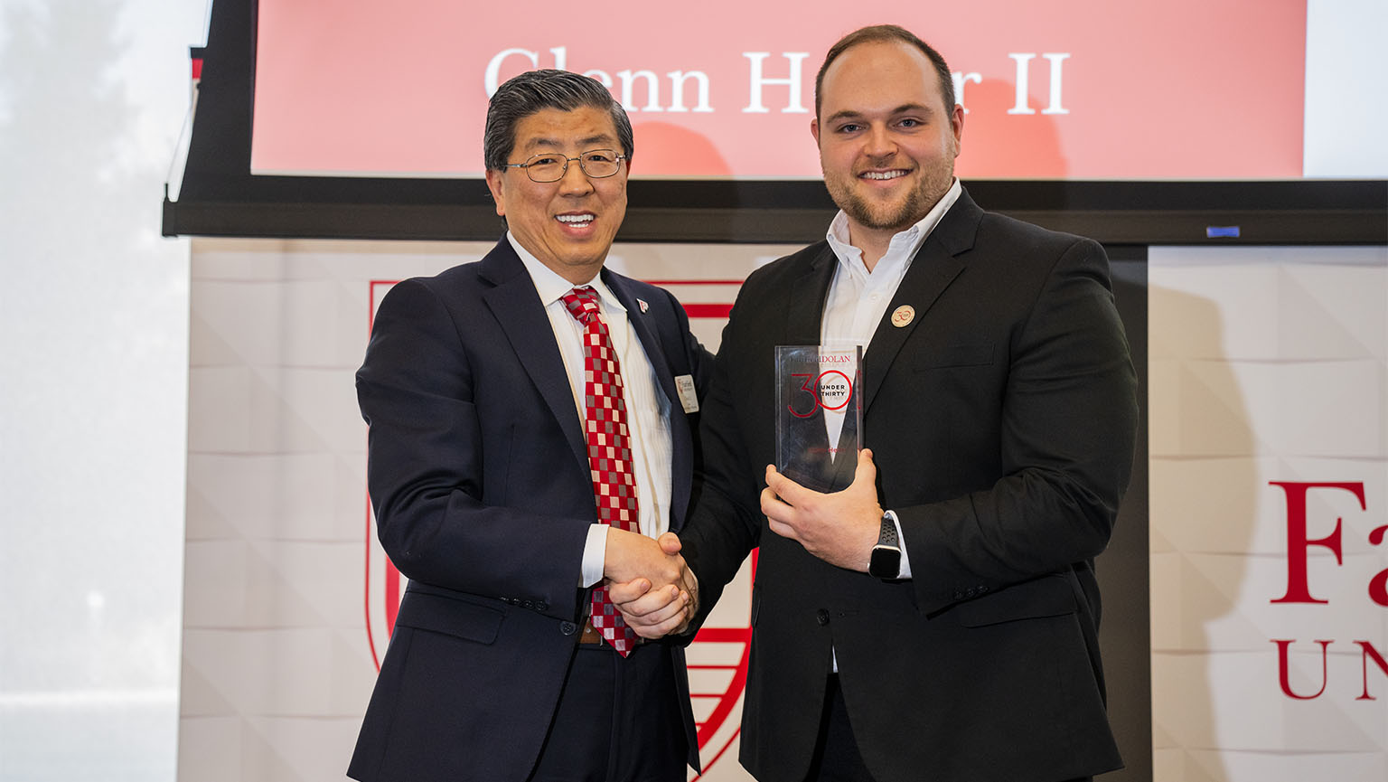 Dean Zhan Li, DBA, with Executive Doctor of Business Administration candidate Glenn Heller II at the 2024 Dolan Awards Ceremony.