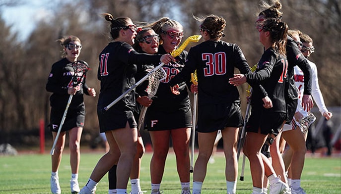 Fairfield Women's Lacrosse celebrates a goal in last month's win at Iona