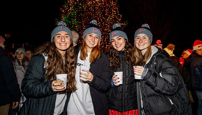 Fairfield University students dressed snugly and enjoying hot chocolate at the annual on-campus Christmas Tree Lighting Ceremony.