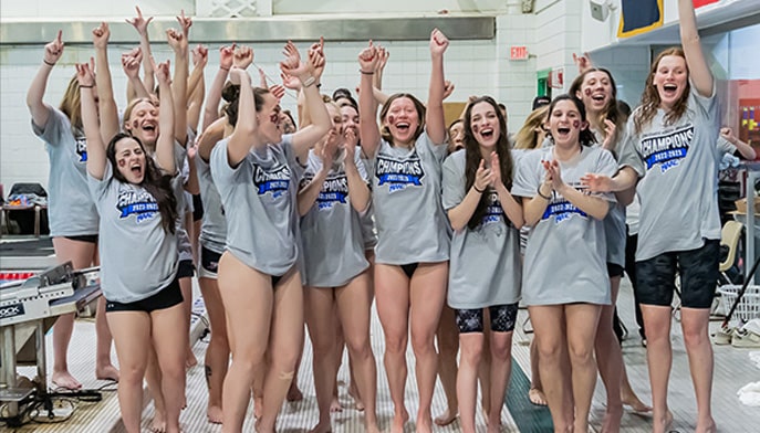 The women's swimming and diving team celebrates its 2023 MAAC Championship. 