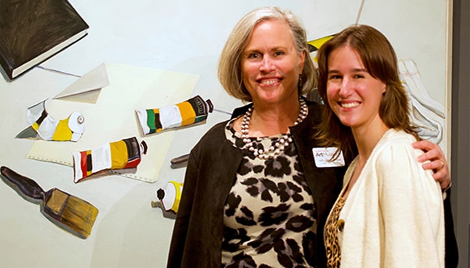 Fairfield University Art Museum Executive Director Carey Weber (left) and Student Curator Phoebe Charpentier ’23 (right) at the "In Their Element(s): Women Artists Across Media" opening night reception.