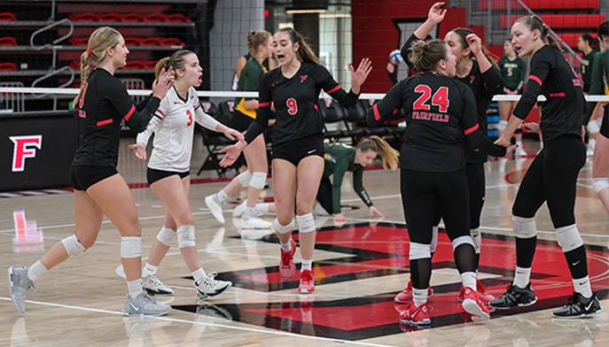 The women's volleyball team celebrate a point in the win over Siena on November 4, 2023.