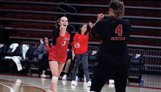 Kyla Berg celebrates a point in Wednesday's win over Iona