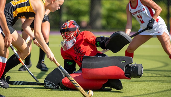 Goalie Payton Rahn '25 makes a against Iowa