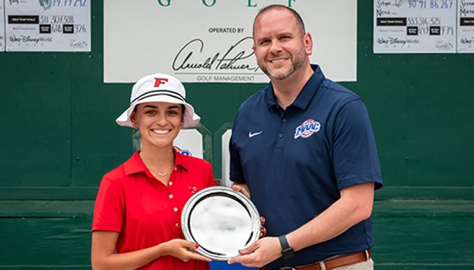 Maria Beltran and MAAC Commissioner Travis Tellitocci with the 2024 McLeod Trophy.