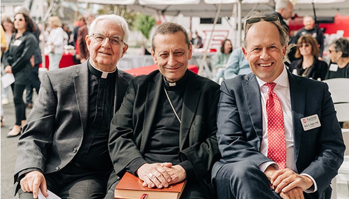 Fr. Gerry, Bishop Caggiano and President Nemec at the Bellarmine Campus ribbon cutting.